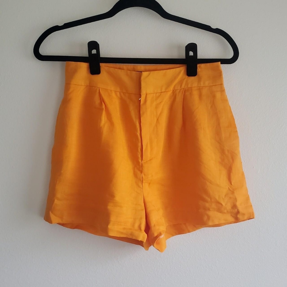 Orange pleated high rise linen shorts